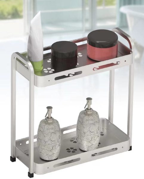 Two-tier square storage rack in a silver finish holding skincare bottles and dispensers on both shelves