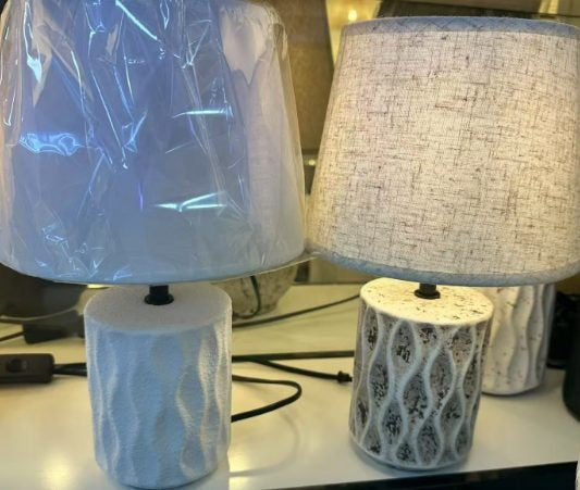 Ceramic table lamps with tapered fabric shades, one white and one sage green