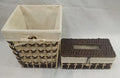 Dark brown woven paper basket with cream fabric liner beside a matching woven tissue box holder