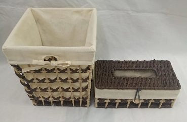 Dark brown woven paper basket with cream fabric liner beside a matching woven tissue box holder