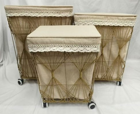 Wheeled wire washing baskets with beige fabric liners and lace-trimmed lids